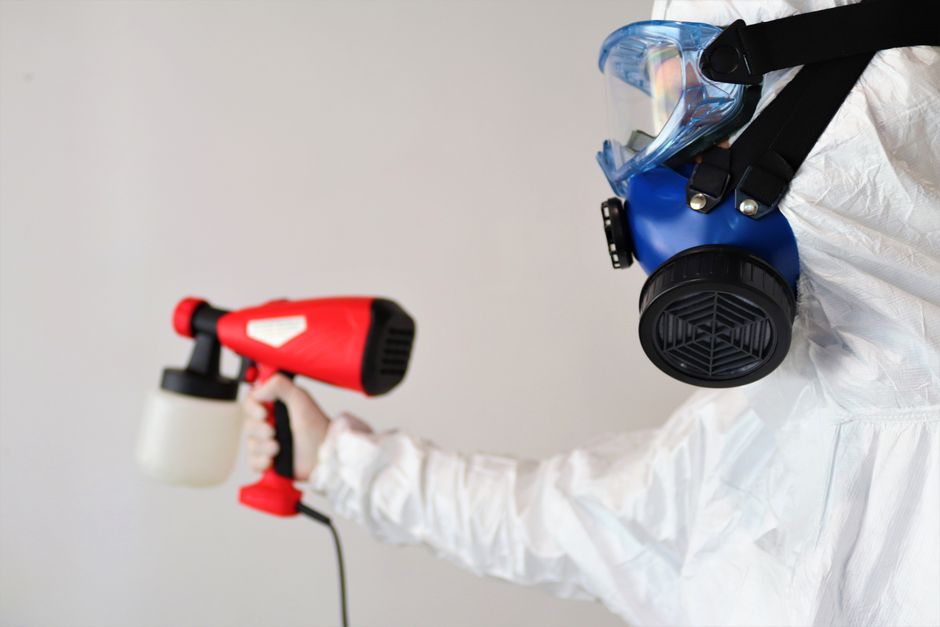 Professional disinfection team applying hospital-grade chemicals in a commercial facility - Commercial surface disinfection